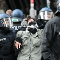 A pro-Palestinian protester at the department of social sciences at Berlin's Humboldt University is removed from the building by police. Activists occupied the university in protest against Israel's war on Gaza [Soeren Stache/picture alliance via Getty Images]